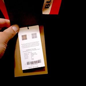 Im selling a new black with red and tan collar burberry London shirt size small